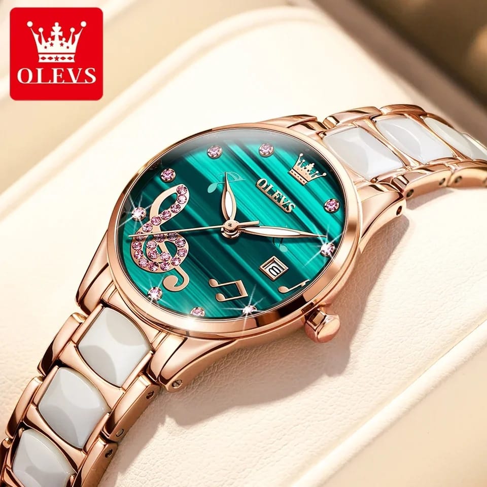 Rose gold watch with green face and white strap on beige background, OLEVS brand visible.