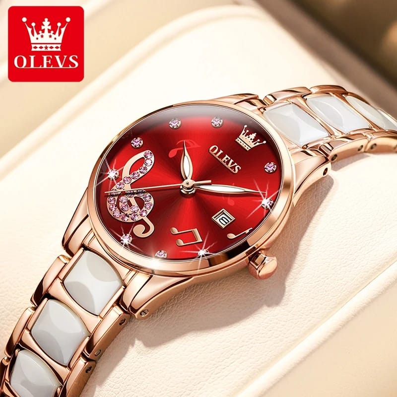 Luxury watch with red face and rose gold casing on a beige background, featuring the OLEVS brand.