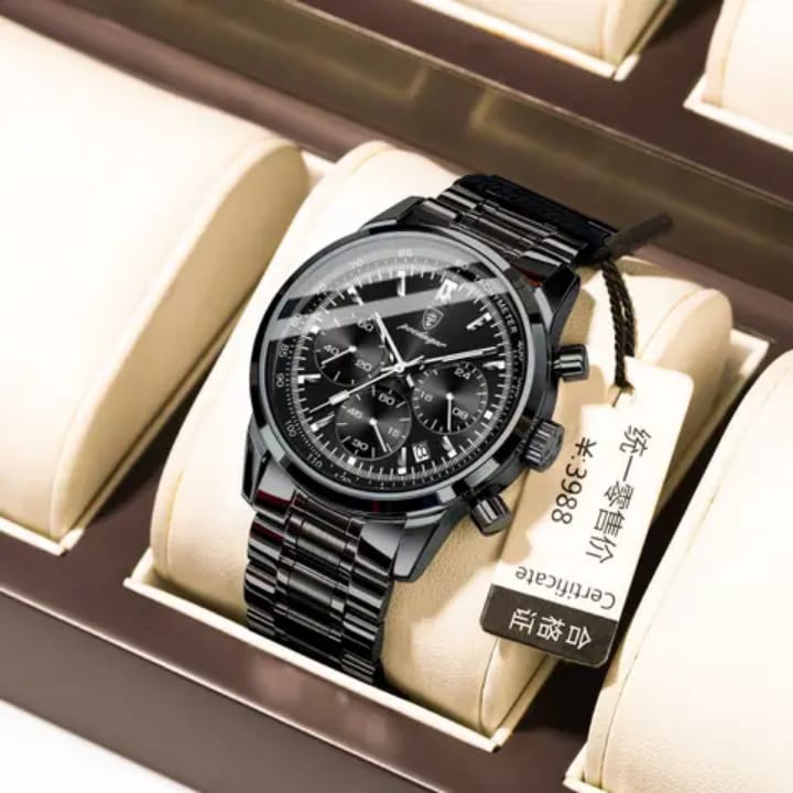 Black wristwatch with metal strap in a display case