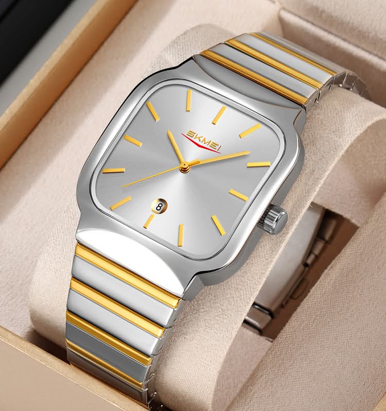 Wristwatch with gold and silver band on a beige cushion