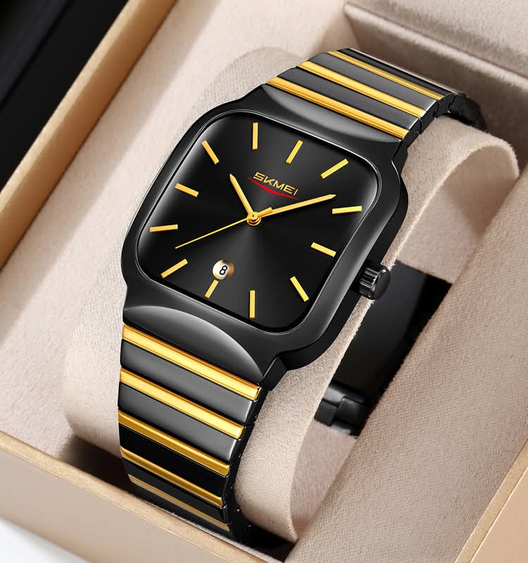Black and gold watch with a brand logo in a box