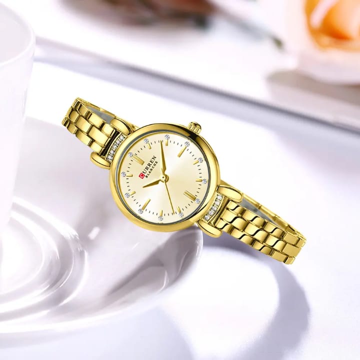 Gold wristwatch on a white background