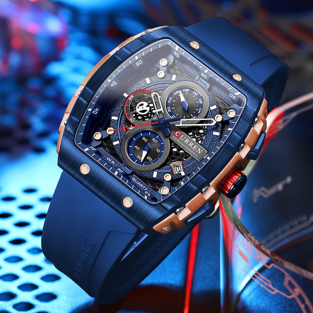 Luxury blue watch with intricate design on a colorful background