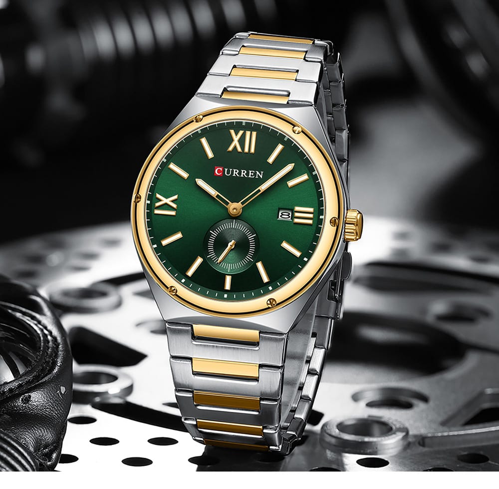 Wristwatch with green dial and gold accents on a mechanical gear background