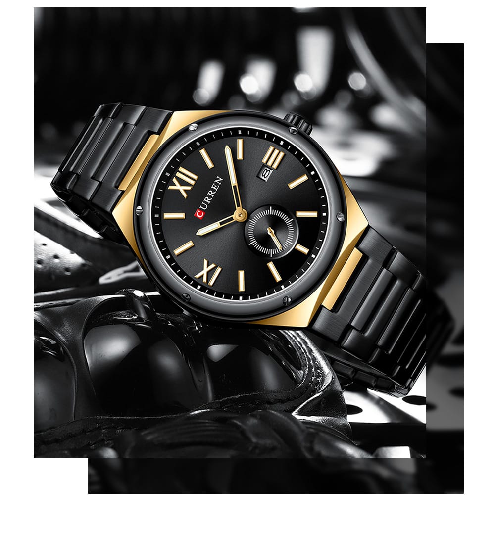 Black and gold watch with detailed face on a dark background