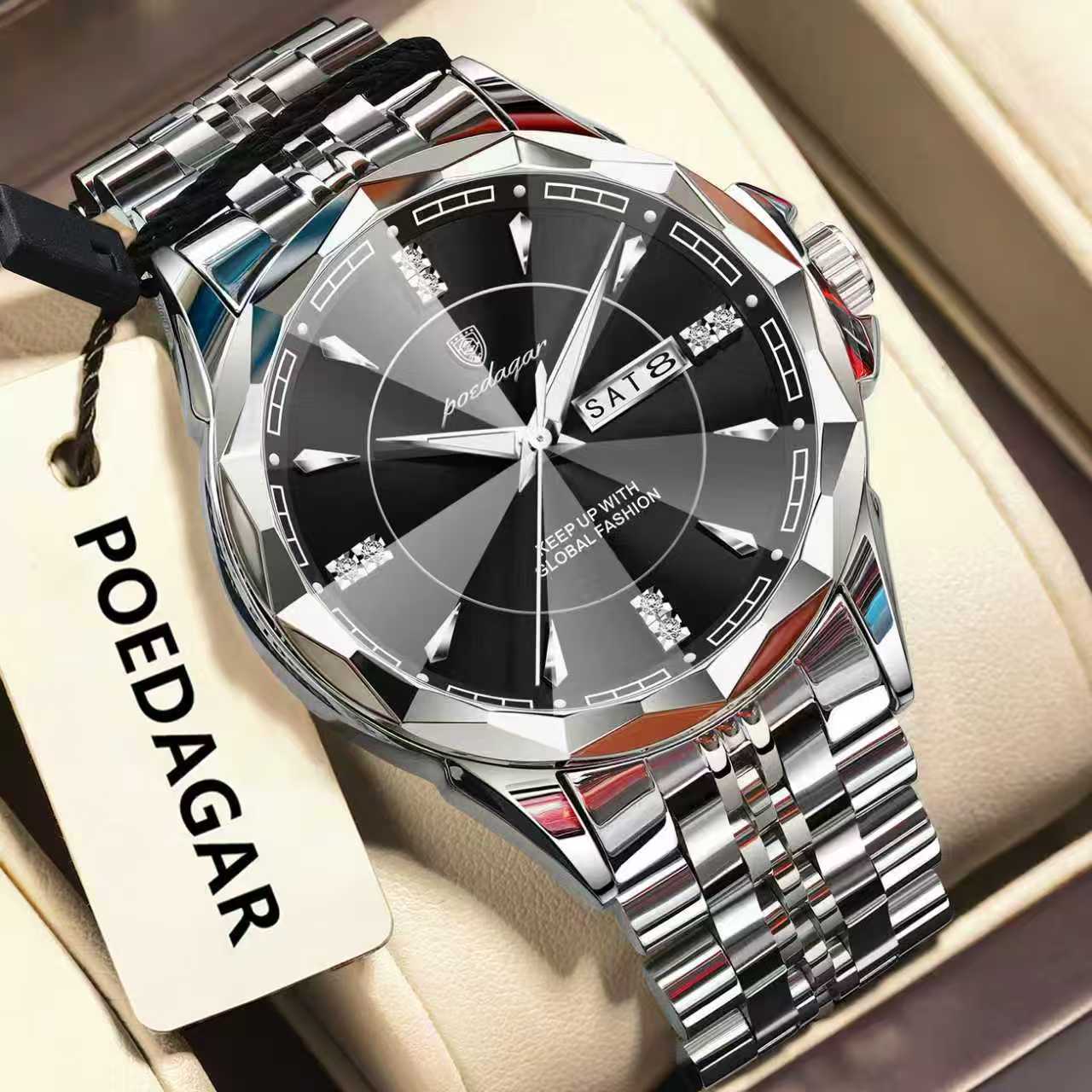 Silver wristwatch with black dial on a beige surface, featuring the brand 'POEDAGAR'.