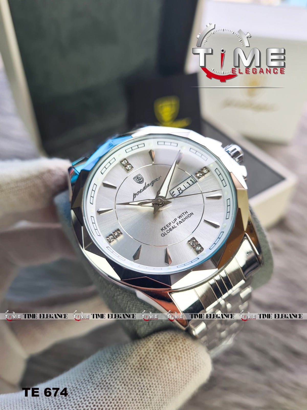 Silver wristwatch with a detailed face on a blurred background