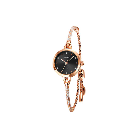 Rose gold watch with black dial on a white background