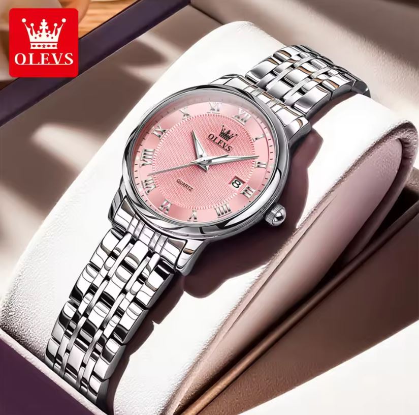 Silver watch with pink dial on a white cushion, brand 'OLEVS' visible