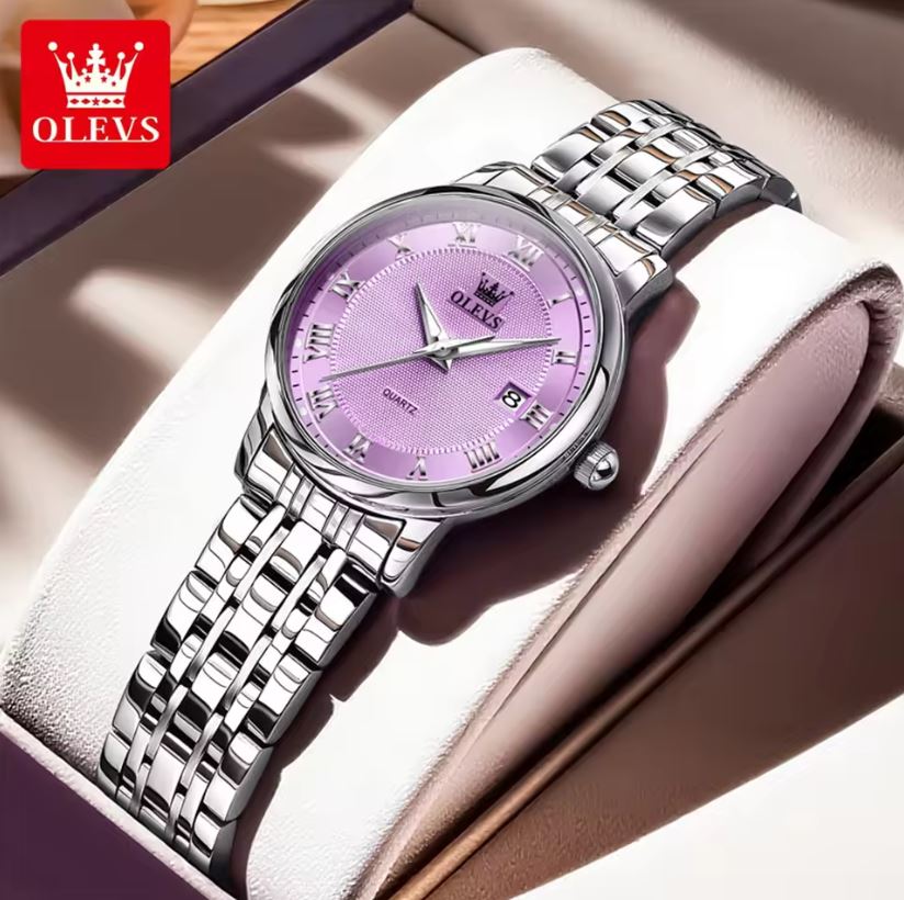 Silver wristwatch with a purple face on a soft surface, branded 'OLEVS'.
