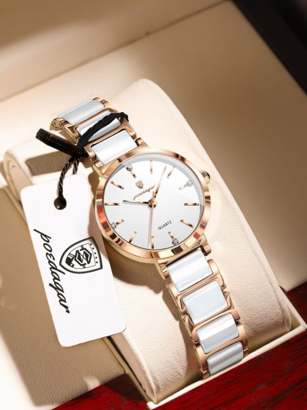 White watch with rose gold accents on a white background
