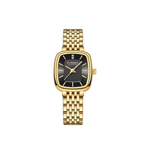 Gold wristwatch with black face on a white background